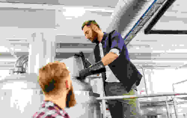 men-working-at-craft-brewery-or-beer-plant-2023-11-27-05-15-15-utc-1